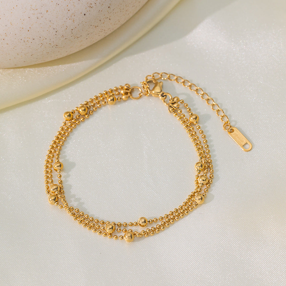 Tobillera en color oro – bolitas tres capas