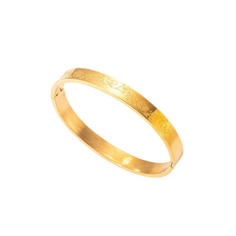 Goudkleurige bangle met patroon